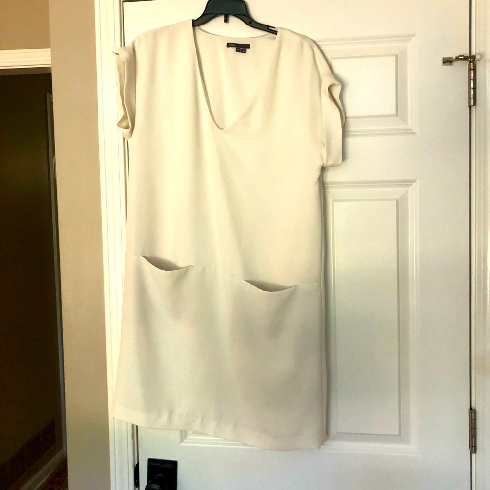 White short sleeve dress with front pockets
